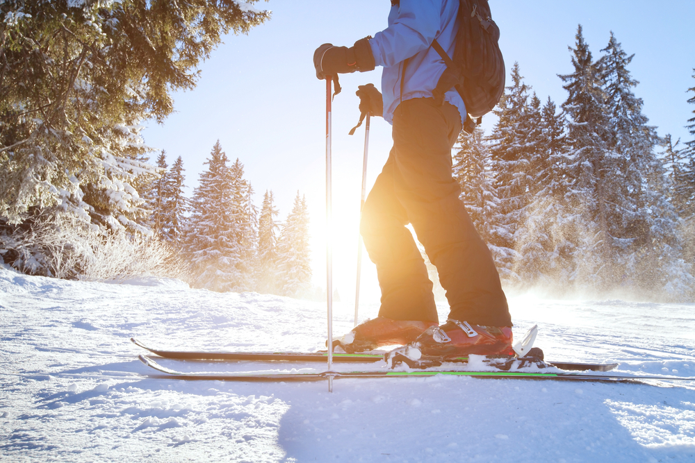 skier enjoys fresh snow on the slopes near their vacation home rental